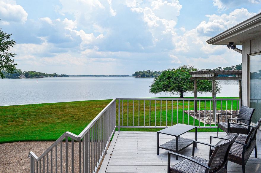 UNBELIEVABLE VIEWS FROM THIS LAKE BALBOA 4 bedroom, 3 bath home with approx. 3,138 sq ft. Situated on flat lot on the point with views from almost every room! Chef's kitchen includes double ovens and refrigerator that conveys.  Open the pocket door to a formal dining room with tray ceiling or transform into a game room or guest bedroom. beautiful STONE FIREPLACE, very private master suite with beautiful views to wake up to. So many features with this one including boat dock with lift and swim platform, 253' on lake with stone seawall, hot tub, custom rock waterfall, pergola with stone sitting area, lake fed sprinkler system, extensive landscaping and much more. Call for all extras! Don't miss seeing this one.