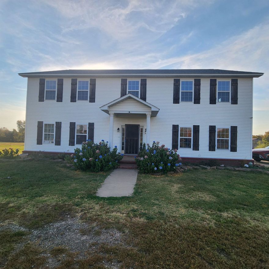 Colonial style 5 bedroom, two & a half bathroom on 10+/- fenced acres with 25'X42" barn built in 2020. Private & peaceful cleared location that is a good mini farm with open pastures for the horses or other farm animals. The kitchen features granite counter-tops & dark custom cabinets. Spacious laundry room, kitchen, dining, living room, primary bedroom & bath are all on ground floor. The upstairs is all hardwood floors & has 4 bedrooms, a bathroom & a huge game room or second living area. New roof in 2018 & new water heater in 2022. A 10x16 storage building also stays. The property is fenced & cross fenced with about 9 acres that has gates & been used for horses & a donkey. Bring the chickens & cows too on this unrestricted land.