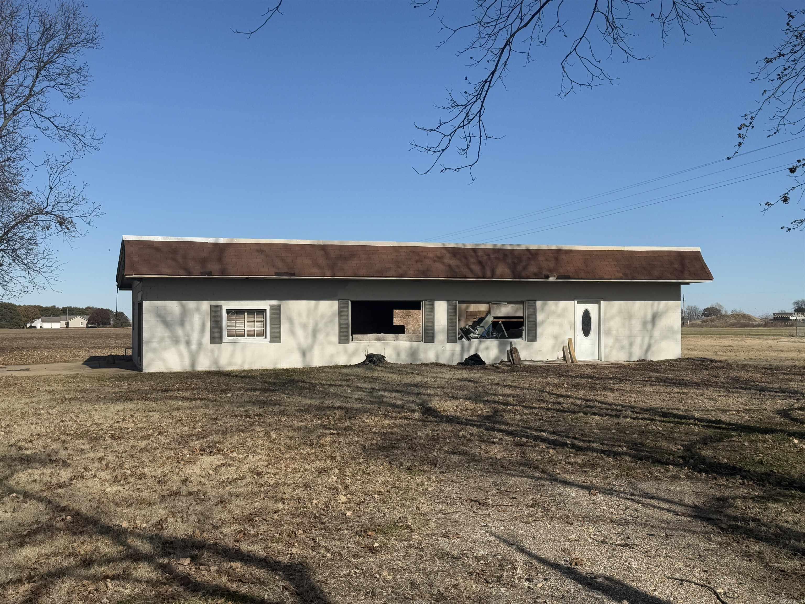 Discover a unique opportunity with this prime corner lot, ideally situated in a high-traffic area. Perfectly positioned beside a bustling daycare and directly across from the reputable St. Bernards Buffalo Island Medical Clinic, this location offers exceptional visibility and accessibility. The property features beautiful pecan trees adorning the front, creating a charming facade. With over 2,000 square feet of potential, the existing structure may need to be demolished, but the sturdy slab offers a solid foundation ready for your vision. Utilities, including septic, water, and electric, are already on-site, making this a fantastic investment for your next project. Don't miss out on this incredible chance to build in a vibrant community!