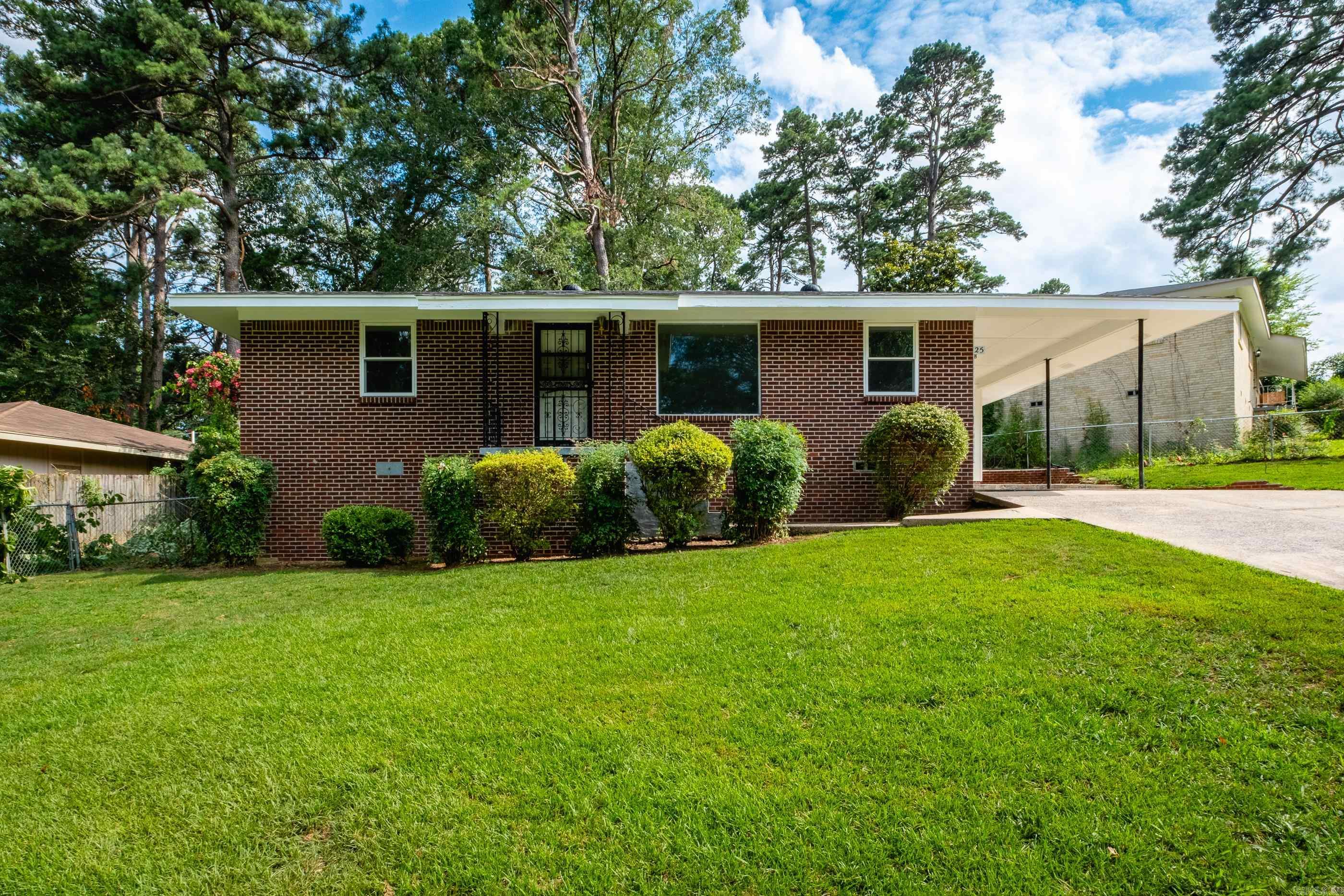 This one-story home is full of potential and ready for a new owner's personal touch! Great opportunity for a homebuyer wanting a home to update & make their own or an investor simply looking for a solid rental close to Univ. of Arkansas Little Rock. Most major improvements have already been completed within the past few years, including: new HVAC system (2023), new architectural shingle roof (2022) and new water heater (2020). Additional features include newer vinyl windows throughout, freshly painted exterior siding/soffit/fascia, brand new interior doors/door hardware and hardwood floors underneath carpet. The eat-in kitchen features stainless steel appliances. Generously-sized living room is open to add'l dining area providing ample space for entertaining. One-car carport + an extra parking pad that connects to side patio.