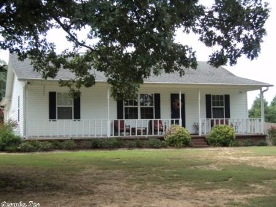 This property has SO much to offer!  Super cute with great layout & tons of updates on one acre.  Living area features barrel ceiling with corner fireplace and hardwood floors.  Great kitchen with lots of counterspace, pantry, and breakfast bar. French doors lead from the dining area to deck overlooking a huge fenced backyard with above ground pool, inground trampoline, greenhouse, & garden area. Two car garage with bathroom! Updates include hardwoods, tile & carpet. New A/C,  dishwasher, & microwave too!