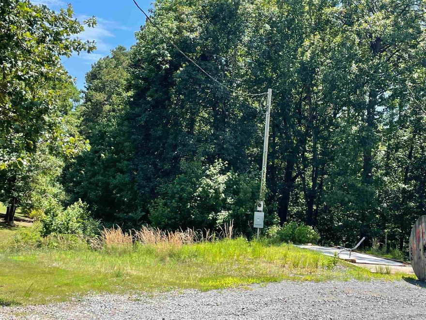 Corner Lot Property located at the entrance of Devil's Fork Park with a lot of potential. Potential Ice Machine business property, already has concrete slab and electric/water hookups.