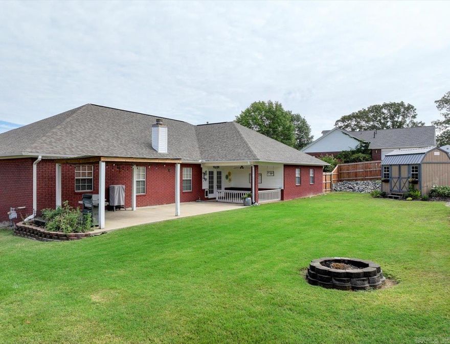 This beautifully updated 4-bedroom, 2.5-bath home in Lake Hamilton School District offers modern upgrades and serene living in a private neighborhood near the lakes. Outside city limits - could make a great Short Term Rental! Recent improvements include new wood floors, carpet, a gas hot water heater, a heat/air system, and an architectural shingle roof. The spacious primary ensuite features a luxurious walk-in shower and tray ceilings. Ideal for entertaining, the home has two covered patios, a firepit, and RV hook-ups.   The large fenced backyard includes an outdoor storage shed or she-shed, adding even more functionality to this peaceful retreat.  Agents - Call Showing service to schedule all showings.