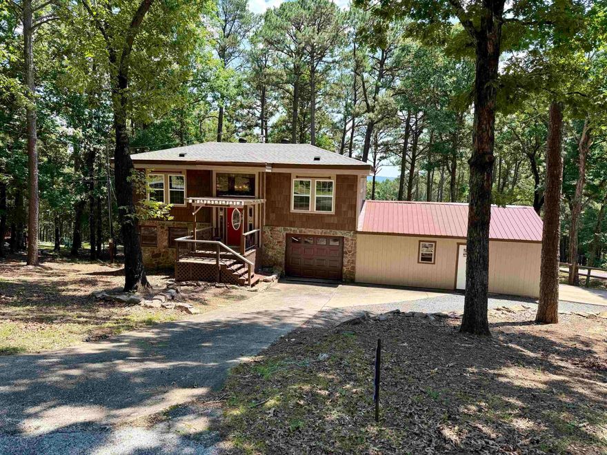 Looking for a move-in ready home near the lake with quality upgrades already completed? This beautifully remodeled Fairfield Bay home offers the perfect combination of comfort, convenience, and long-term value. Recent improvements include a new Lennox HVAC system, premium DaVinci roofing shingles, new windows, front door, patio doors, updated fixtures throughout, and a new grinder pump. Inside, you'll love the warmth and character of the solid pine wood floors and the completely renovated bathroom featuring dual showerheads for a spa-like experience. The home also offers exceptional parking and storage with an attached two-car garage plus an additional single-car garage. The owned propane tank adds extra value, while fiber internet availability makes working remotely or streaming a breeze. Located just blocks from the Fairfield Bay Marina, this property offers seasonal lake views and easy access to all the outdoor recreation Fairfield Bay is known for. Need more room? Two additional lots are available for purchase, providing extra privacy, future building opportunities, or room to expand. Most furnishings can be purchased additionally!