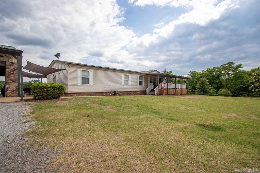 4 bed, 2 bath double-wide on 3 fully fenced acres with permanent foundationācountry living at its best! Inside, enjoy custom finishes, luxury vinyl floors, and updated countertops (2023). New roof and HVAC in 2021 offer peace of mind. Step outside to a brand-new $13,000 deck wrapped around a well-maintained above-ground poolāpool furniture can stay with strong offer! The 3-car garage features a man cave with electricity and a mini split, plus thereās an additional shop and a storm shelter on site. Peaceful, move-in ready, and packed with value!