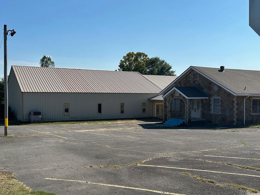 Don't miss out on a prime location for your business with excellent Highway 65 frontage in the heart of Greenbrier! The buildings offer a range of possibilities for your business. This would make a great church, daycare, preschool, or any other business opportunity. There are 2 buildings included with this property, on approximately 1.50 acres. A large metal building with approx 7,500 sf that was completed approximately 6 years ago, which has a large fellowship hall with kitchen area, 4 classrooms, utility room, a large auditorium with plenty of space for your needs, a balcony ready to be finished, and 2 bathrooms. There is a historic rock building next door that dates to the early 20th century. So many possibilities in this historic building! There is a 1,102 sf, 2 bedroom, 1 bath house and additional 1.0 acre adjoining the buildings that is offered for sale, as well. This property has so much potential in this high traffic location!
