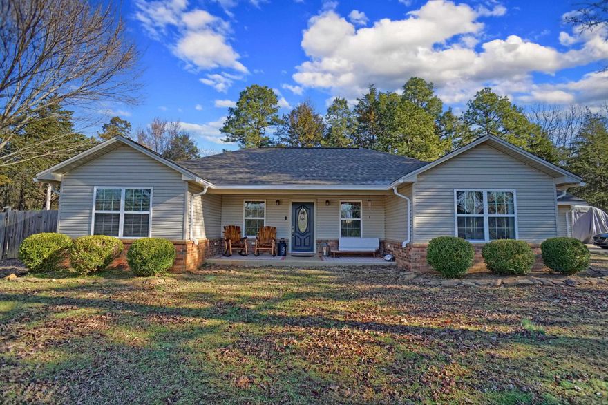 Escape the hustle and bustle with this charming 1,592-square-foot retreat, perfectly nestled on 1.72 acres MOL just outside the city limits. Surrounded by a serene, park-like setting, this gem boasts three spacious bedrooms and two full baths, offering plenty of room to spread out. Step outside to an entertainer's dream — a sprawling patio area perfect for summer BBQs, plus a cozy fire pit area where you can unwind under the stars. With its peaceful vibe and convenient location, this property is the perfect blend of country charm and everyday comfort. Don't let this slice of paradise slip away!