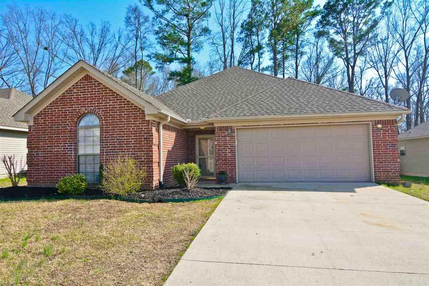 Wonderful 3 bedroom home with two baths, featuring unique open floor plan that opens from front door, to living area and finally to eat in kitchen area.  This house has the must-haves that all buyer's want.....tray ceilings, beautiful molding, oak cabinetry in kitchen. Master bathroom has two full separate closets and shower has two shower heads. Beautiful walnut flooring added to foyer and living room only a year ago. Great backyard that backs to land privately owned.  Shop with a/c and fully electric.