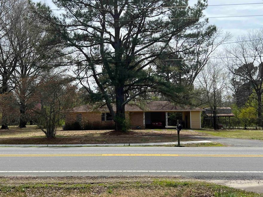 HIGH Traffic count with utilities on property. Close proximity of Wal-Mart Super Center and many businesses. Located approx. 1/2 mile from interstate. Zoned commercial, presently a home on property, 1280 sq,ft. Additional acreage available, see MLS#23008180. See Agent Remarks!