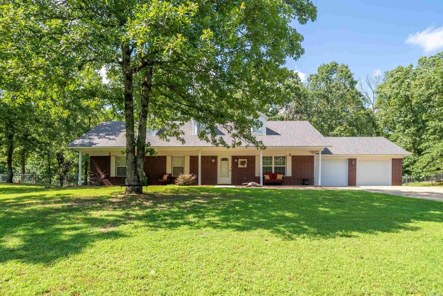 Charming Brick Home on Nearly an acre- Walking distance to Lake Hamilton Schools. This beautifully updated 3 bedroom, 2 bath home sits on a spacious 0.90 acre lot with a large fenced backyard and a large covered front porch. Updates include: roof (2020), HVAC (2020), water heater (2019), new carpet, freshly painted interior, and an outdoor storage building. Enjoy the comfort of a move in ready home with modern touches and classic charm. Call to schedule your showing today!