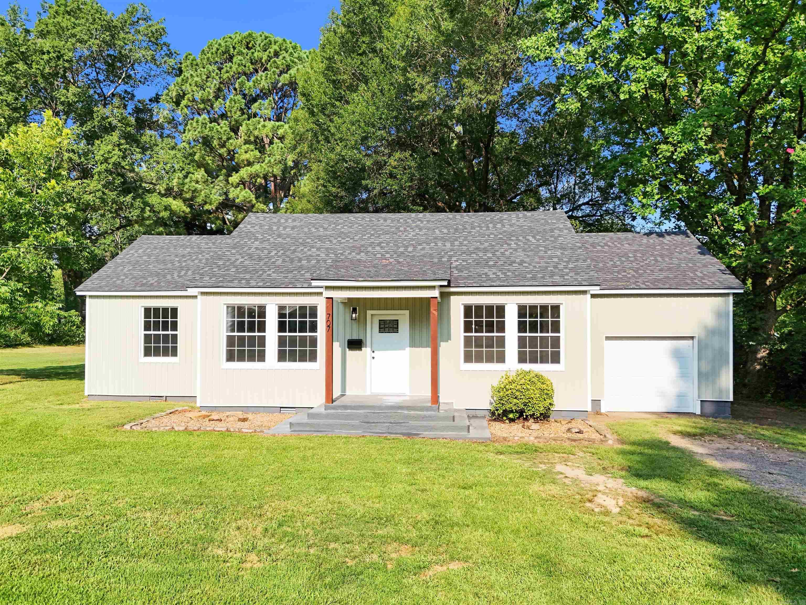 This beautiful home blends the character of an older home with the comfort of modern updates! From the moment you arrive, you'll notice the new siding and new roof, giving the home great curb appeal. Step inside to find original wood trim that adds timeless charm, new Low-E windows (installed in 2019) for energy efficiency. Heating & Air system (installed 2018). Kitchen will be refreshed with new Granite Counter tops (install in a couple of weeks). Updated flooring though out the home of a classic, fresh look. The bathroom includes a few thoughtful updates as well. All of this sits on 3 spacious city lots, offering plenty of room to enjoy the outdoors. This is a wonderful opportunity to own a home full of updates in all the right places! (Storage Building in backyard)
