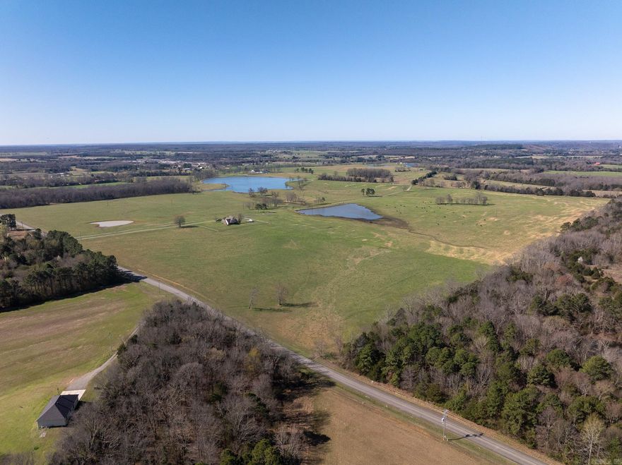 Plants Chapel Cattle Farm is a turnkey cattle operation ready for immediate use. The property has been well maintained, with years of spraying and fertilization improving forage quality and production. Farms of this caliber are increasingly rare.  The farm features five paddocks, each with water access, and includes fencing, gates, and cattle guards. Cross-fencing allows for efficient rotation and grazing management. Access is excellent, with paved Turner Road along the east boundary and Highway 36 just south of the property, providing ease of entry for equipment and livestock transport.  The land also offers strong homesite potential, gently rising to the north with views of the lake and surrounding countryside. Multiple potential building sites provide flexibility for future improvements and layout options. Abundant wildlife provides additional recreational and hunting opportunities.  Located just outside of Rose Bud, the property is approximately 20 minutes from Searcy and Highway 64 at El Paso. This property offers a combination of productive pasture, functional infrastructure, convenient access, and desirable building sites.