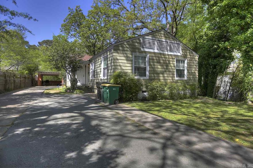 Cute spacious 2bed 1bath unit in a Duplex features hardwood floors through out with large private yard, one car covered carport. This adorable unit comes complete with a washer/dryer, refrigerator, and microwave.  The island you see in the kitchen also stays. Updated bathroom and fresh coat of paint. New owners- Yard is amazing. Call Jim for personal tour today at Call Jim @  501-765-0250