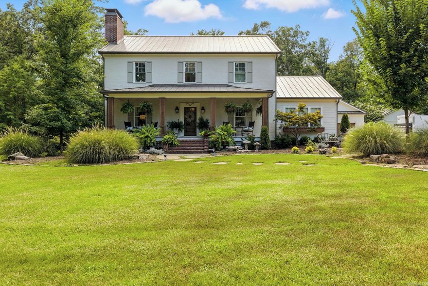 Two houses for the price of one! Step into a home that feels straight from the pages of Southern Living magazine. Just 10 miles from Chenal, this modern farmhouse sits on 5 acres of landscaped grounds, offering a paradise-like retreat with timeless charm and modern convenience. The 3,127-sf main home features 3 bedrooms and 3 bathrooms, with a kitchen showcasing marble counters, a cozy sitting area, double ovens, and a formal dining room. A butler’s pantry with designer finishes adds elegance and function. Upstairs, a serene primary suite is joined by two bedrooms with a Jack & Jill bath. Outdoor living shines with lush landscaping, a 30x30 garden, a pool, and large screened porches for year-round enjoyment. Added perks include an extra-deep 2-car garage, floored attic storage, and a full house generator. The 1,144-sf carriage house, built in 2018, offers 2 bedrooms and 1.5 baths and is currently generating rental income—ideal for guests, multi-gen living, or extra revenue. Close to the Promenade, Pinnacle Mountain, Moss Mountain Farm, and local wedding venues, this refined retreat is minutes from everything. Agents see remarks.