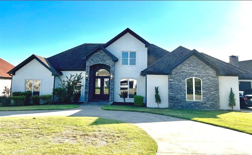 Sold Before Listed. Majority of the Interior was updated in 2021. Roof and exterior paint 2023. Stainless steel kitchen appliances, Quartzite kitchen counters, island has a beverage refrigerator, pantry, & separate laundry room. Main floor features tall ceilings, separate dining room, large master bedroom split from 3 other bedrooms with a full bathroom. Master bathroom has his & her sink area, vanity area, granite countertops, large jacuzzi bathtub and large separate shower with double shower heads. Huge master closet. Upstairs features the bonus room with 5th bedroom or office, full bathroom, balcony overlooking the backyard. 2 doors to the attic with a lots of floored area for storage. Bar area with cabinets, sink, & beverage refrigerator. 2 tankless water heaters. Large fully fenced backyard with covered patio with curtains all around, separate deck area for dining, outside kitchen, massive salt water pool, pool building with half bath, storage closet, & area to hang a large TV for entertaining. 3 car garage, one is big enough for a boat.
