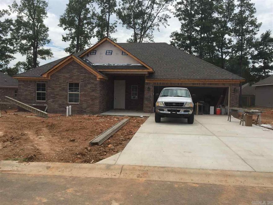 100% brick home, open floor plan, crown molding, huge island in kitchen, granite counter tops throughout, handscraped wood laminate flooring in all main areas. Large custom tile shower in master bathroom, covered back porch.