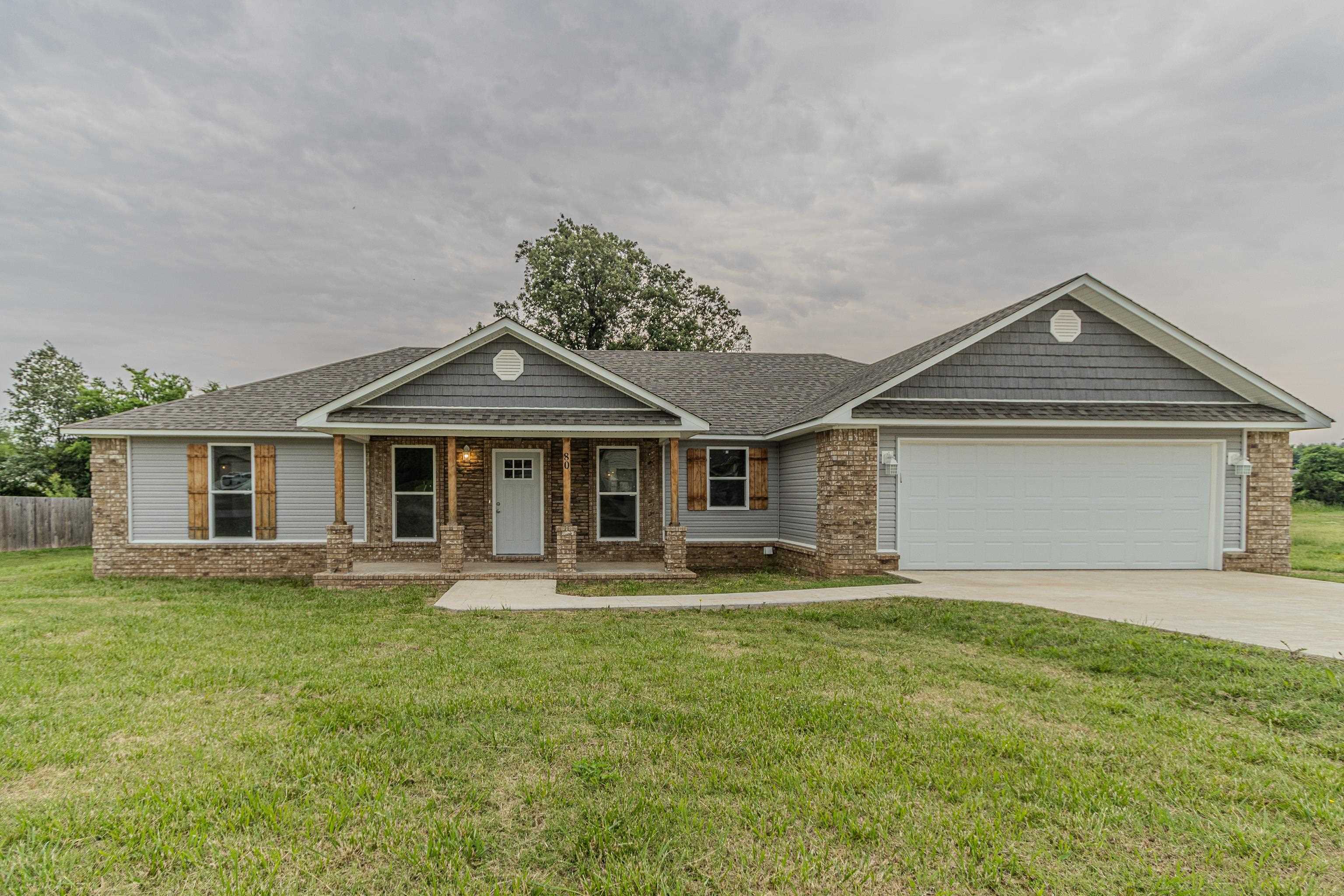 **Beautiful 3-Bedroom Home with Modern Finishes on Spacious Lot** Welcome to this stunning 3-bedroom, 2-bath home offering 1,673 sqft of comfortable living space, all set on a generous 0.42± acre lot. This home combines style and functionality with LVP flooring throughout the main areas and plush carpet in the primary bedroom for added comfort. Enjoy cozy evenings in the living room featuring a custom-designed fireplace that adds warmth and charm. The kitchen is a chefās dream, equipped with sleek quartz countertops, a large center island, and ample cabinetryāperfect for entertaining or casual family meals. Step outside to a spacious deck overlooking the expansive backyardāideal for summer BBQs, relaxing, or creating your dream outdoor space. A two-car garage provides plenty of room for parking and storage. With tasteful updates and a layout that flows effortlessly, this home offers comfort, space, and style in one inviting package. Don't miss your chance to make it yours!