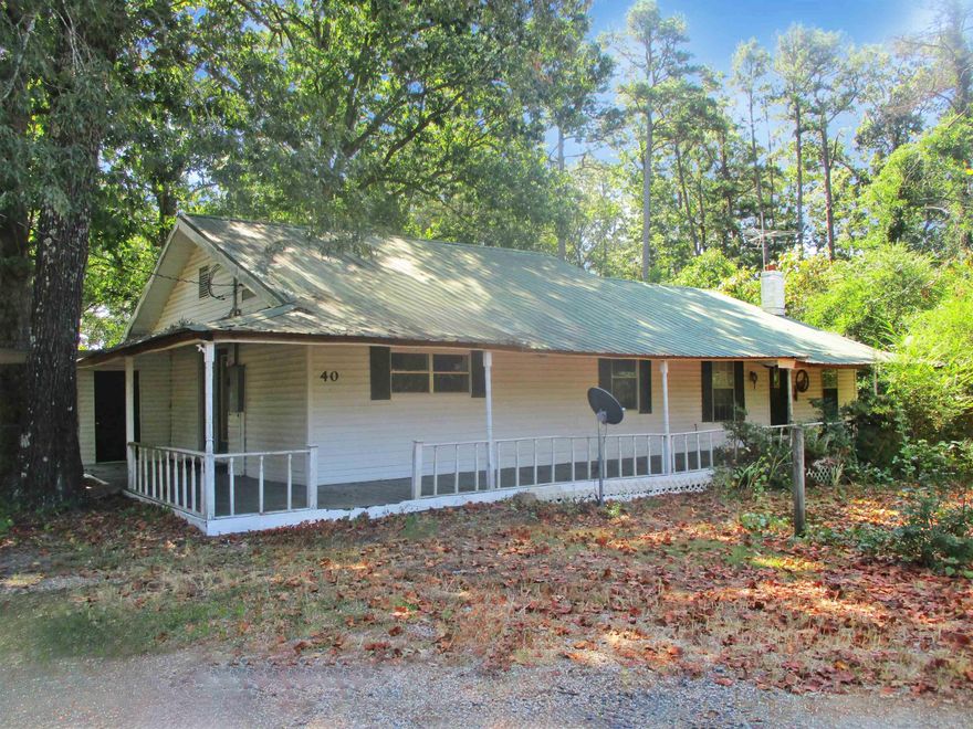 This inviting ranch-style home provides convenient single-story living on .90 acres with shop and garage. This two-bedroom, two-bathroom property offers substantial investment potential for buyers seeking to create value through thoughtful renovations. A covered front porch welcomes visitors and small fenced areas for children or pets.  Schedule your appointment today to see this one.