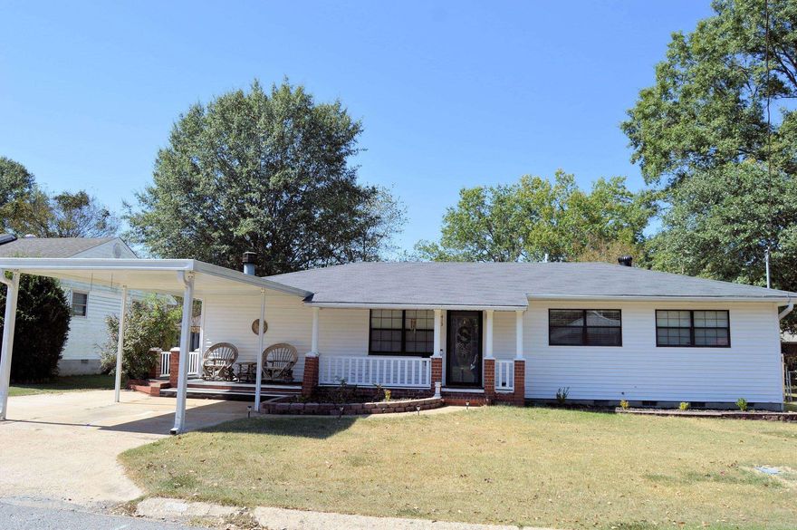 Cutest house located in downtown Benton- close to everything with easy access to I-30.   This home has a fantastic floor-plan with a large kitchen with a ton of storage and a large great-room with a wood-burning fireplace.   The laundry room is located right off the kitchen and is over-sized with extra storage.  Home has a cute wrap around porch which can be accessed from the front or the side off of the kitchen.  The back has a cozy covered back patio and a fully fenced back yard.  There is covered parking in the back with a gate and also a covered carport on the front.   Plenty of room for all your toys!  There is a storage building in the back!~ Tons of updates!   Home has all new floors, paint, all new electrical throughout, new roof, updated tile in both bathrooms.  Hot water heater only a couple of years old.  HVAC 5 aprox 5 years.   Put this one on your list to come tour!  Agents see remarks