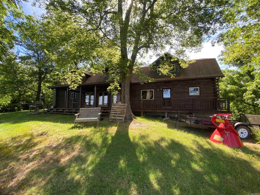 7 bedroom, 4.5 bath, 2 car garage, 2 fireplaces and much more with this 3,484 sq ft log cabin.  WOW. What a spread. 1,323 acres of timber, creeks and wildlife. Roads all thru the property make it great for riding 4 wheelers or side x sides. Plenty of food plots for the deer. Even a view of White River in some places.  Would make a great hunting lodge, place to get away or permanent residents. Lots of possibilities. Close to Mountain View, Anglers Cafe and Jo Jo's Catfish Wharf. Mineral rights convey.