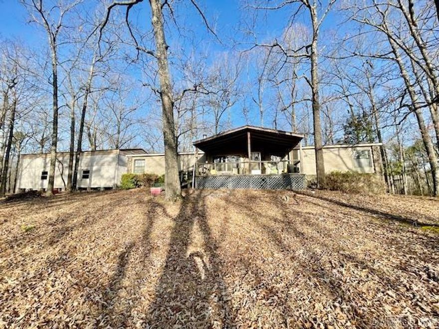 Don't let this incredible opportunity pass you by! Nestled on 10 acres in the East End Community of Saline County, this charming country home boasts 1,904 square feet of living space, featuring 3 bedrooms and 2 bathrooms. Enjoy a spacious great room complete with a wood-burning stove, a formal dining room, and inviting front and back decks. Additionally, there's a large shop that holds the potential for future living quarters. The picturesque land is adorned with beautiful hardwoods and fruit trees. With a bit of TLC, this property could truly shine. Contact us today for more details!