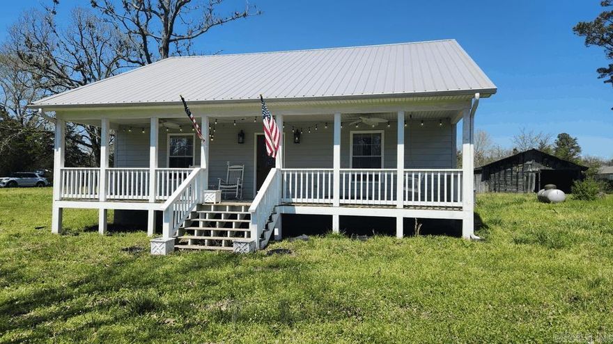 Built in 2021, this 2 bedroom 1 1/2 bath farmhouse in Story AR with 1596 square feet living space is perfect for the retirement era of your life or the beginning of the simple life. Everything is new/barely used. Quartz counter tops, laminate flooring throughout, covered porch on the front and the back for lots of out door time, gas range, gas logs, on demand water heater, and a dishwasher are some of the features of this home. The 1.88 acre tract is easy to maintain and fenced. Lots of natural light. Current survey. Well and septic. Central heat and air. There is a barn for storage. And at certain times of the year, there is a nice view of the Muddy Creek Wildlife Management Area. Only 4 miles to Lake Ouachita.