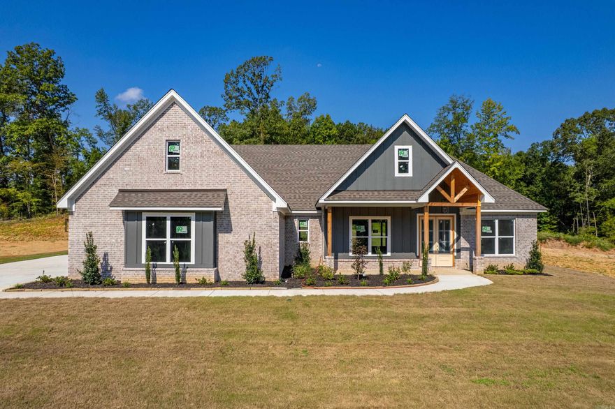 Stunning new construction ready for a family! Open concept home with split floor plan.  Spacious laundry room adjacent to large primary closet and ensuite.  Kitchen boasts beautiful granite countertops, custom backsplash, and nice walk-in pantry.  Dining area is open to family room and kitchen, great space for entertaining.  One additional ensuite, along with 2 bedrooms and a bath off living area.  The secluded backporch of this home is made for entertaining family and friends with woodburing fireplace, plenty of room for grilling and backs up to wooded area.  Well thought out landscaping adds curb appeal to this gorgeous home.  In addition, there is unfinished space above the garage for future expansion.