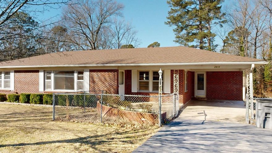 Charming 3-bedroom , 1.5-bath home offering 1728 sq ft of living space with origional hardwood floors. Situated on an oversized .90 acre lot inside city limits, this property provides space, privacy, and convenience.  Features a covered back deck overlooking a fully fenced yard, a detached garage/workshop, and a covered carport and aparking space for two vehicles in front . Recent updates include a roof 4yrs ,a new gas service to home, and a newly paved drivway. Built in 1964,