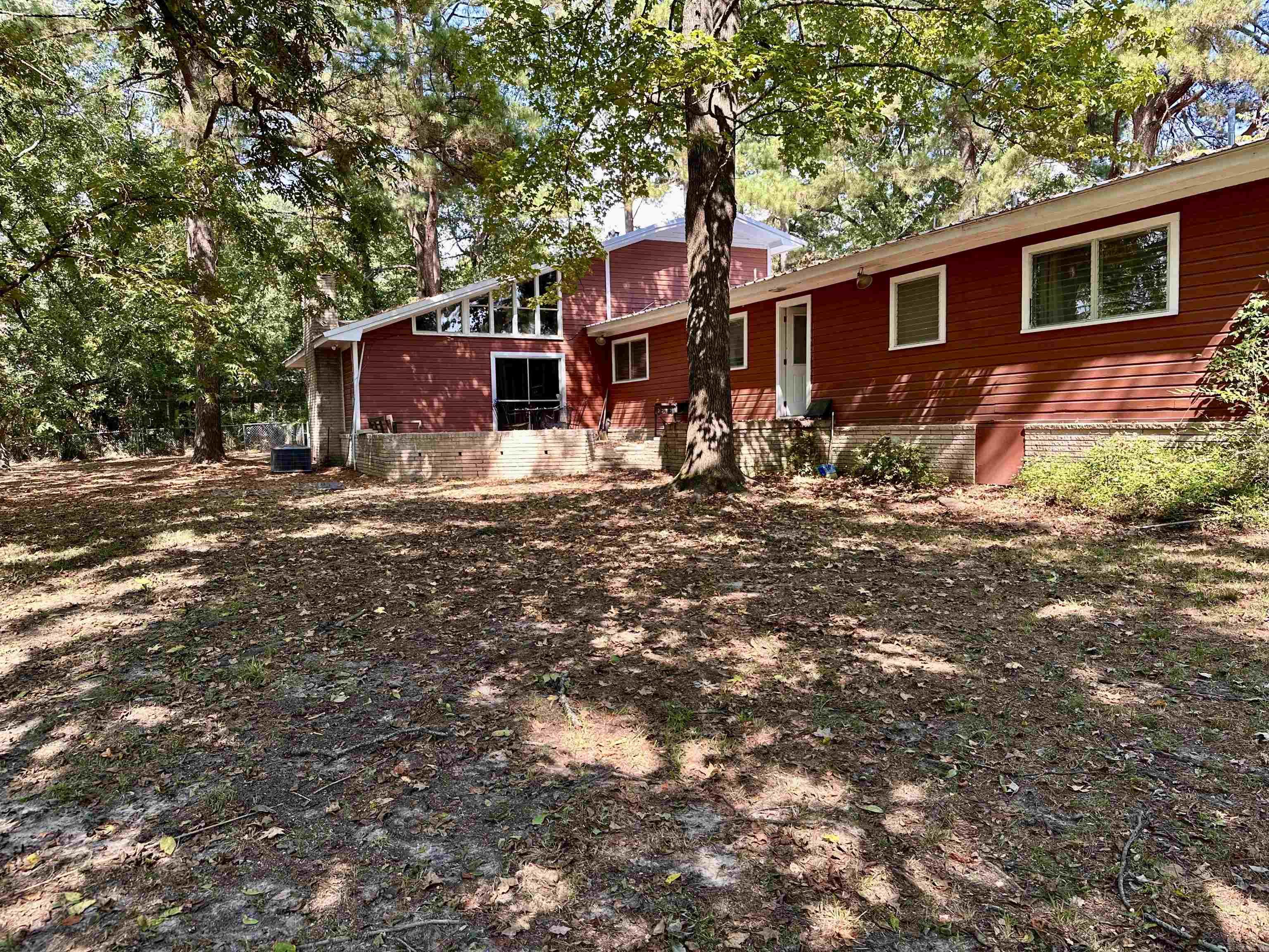 This a great house located on 1.51 acres with 4 bedrooms, 3 baths. This home has 2 living areas with a fireplace in the family room. Off the family room is an upstairs bonus room and a 4th bedroom and bath. The large kitchen has plenty of cabinets, original farm sink, dining area and real knotty pine wood paneling. the other 3 bedrooms are large with 2 sharing a bath and the 3rd has in suite bath. Original wood floors throughout the house. When you go outside not only do you have a large front yard but you have a really large backyard for entertaining, grilling or plenty of room for the kids to play with their friends. You don't have to worry about being too close to your neighbors in this location.