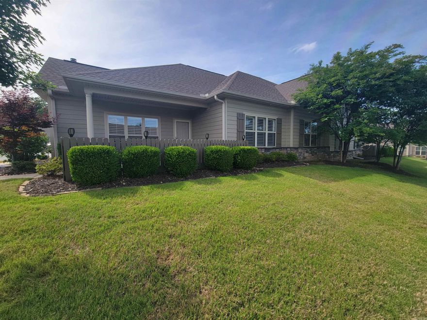 Built in 2017 by Wayne Moore Construction, this stunning one-story townhome offers easy, stair-free living and a host of high-end upgrades. You'll love the open floor plan, spacious rooms, and thoughtful details throughout, including rich hardwood floors, plantation shutters, and elegant crown molding. The home features a tankless water heater for energy efficiency, a smart garage door opener for added convenience, and ample floored attic storage. Located in a peaceful neighborhood, residents enjoy access to wonderful amenities like a swimming pool and clubhouse—perfect for relaxing or entertaining.