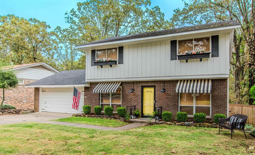 Totally updated and move-in ready! Just a two-minute walk to the highly sought-after Crestwood Elementary, this charming 3-bedroom, 2.5-bath home blends character with modern updates. Original hardwood floors run throughout the home, adding warmth and timeless appeal.  The den features an electric fireplace and a large picture window, filling the space with natural light. It opens seamlessly to the eat-in kitchen and formal dining room (currently used as an office). The kitchen shines with new countertops, stylish backsplash, stainless steel appliances, and a pantry for extra storage.  A bonus room on the main level offers flexible space—perfect for a playroom, home office, or second living area. Upstairs, you’ll find three spacious bedrooms and updated baths.  Step outside to a park-like backyard oasis, ideal for relaxing or entertaining. Don’t miss your chance to make this one yours—schedule your showing today!