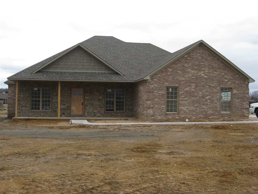 Beautiful 4 bed, 2.5 bath home with lots of extras.  Hardwood and tile floors, extra 7' X 13' attached storage area, jet tub, gas log fireplace, brick w/ rock accents, cedar beams and shake siding.  Buy now and pick items not already ordered or installed.  Estimated completion: April 1, 2015.