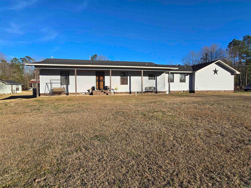 This spacious property offers the perfect blend of functionality, comfort, and country charm. The land is well-improved with two barns—the main barn measures 34x70 with 200-amp power, while the second barn is ideal for animals or equipment storage. You’ll also find two utility buildings, including a 16x21 building with a window unit air conditioning, plus an additional small tin building for extra storage.  Relax on the 10x46 covered back porch and enjoy the peaceful surroundings, complete with timberland and a year-round creek that truly enhance the country living experience. Major upgrades add tremendous value, including a new HVAC system in 2022, new roof completed in 2023, a storm cellar, and a whole-house generator for peace of mind.  The home features mostly 36-inch interior and exterior doors, a circle drive, and three exterior security lights for added convenience and safety. All of this is located just a short distance from Main Street Malvern, offering privacy without sacrificing accessibility.
