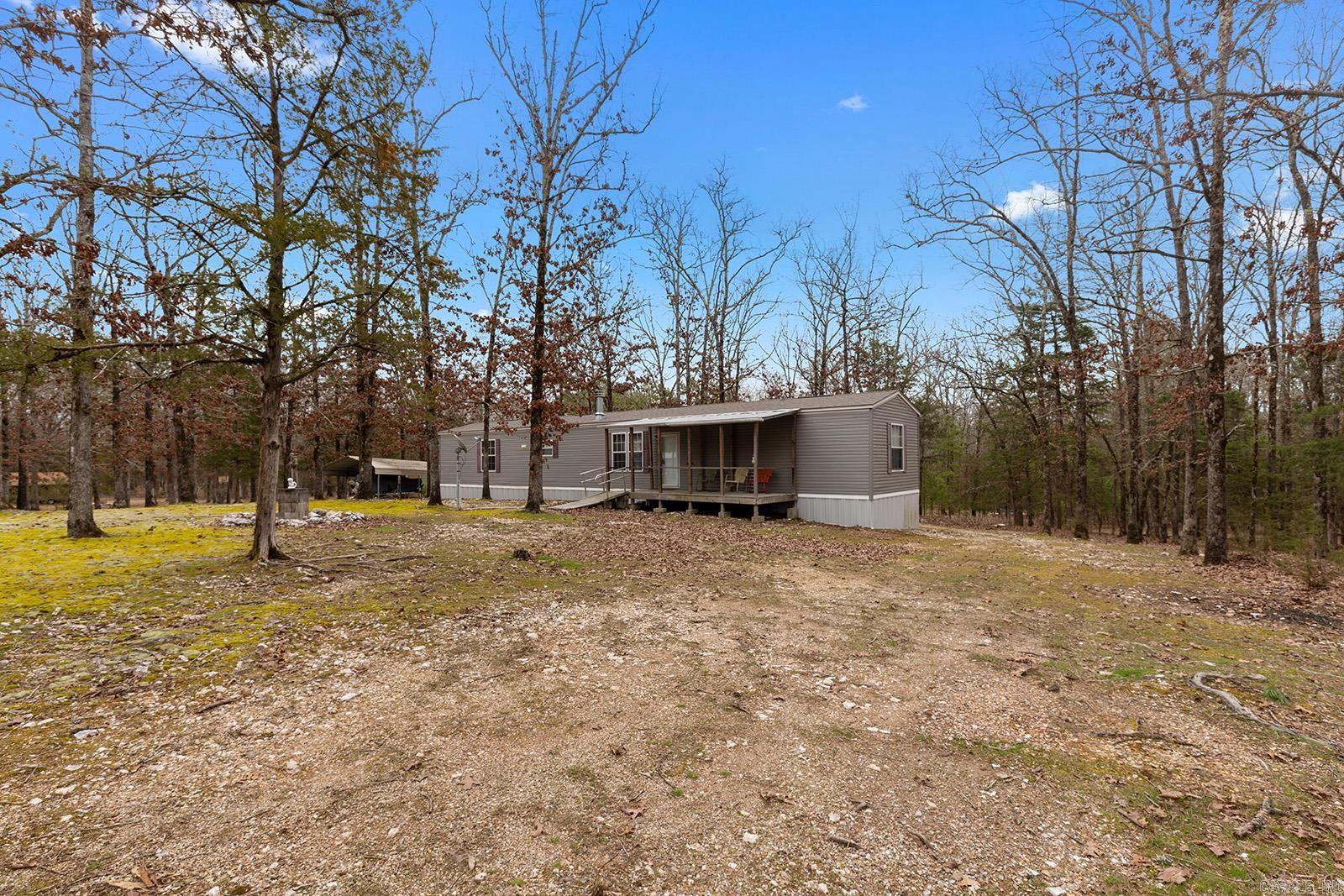 LAKE OUACHITA ā LITTLE FUR S/D, MT. IDA $205,000 | Approx. 1.43 acres (2 lots) | Furnished Less than 5 minutes from a boat ramp, Lake Ouachita, and campgrounds, this property is a hunterās and fishermanās paradise! This home boasts an inviting open layout, highlighted by a spacious granite island ideal for cooking and casual dining. Two large windows let in plenty of natural light, while stylish built-ins and generous cabinetry offer excellent storage. Step outside to enjoy covered wooden porches in both the front and back, perfect for year-round relaxation. A carport provides covered parking, and furnishings convey, making this a move-in-ready retreatāperfect as a full-time home or rental! You wonāt be disappointed! Agents See Remarks