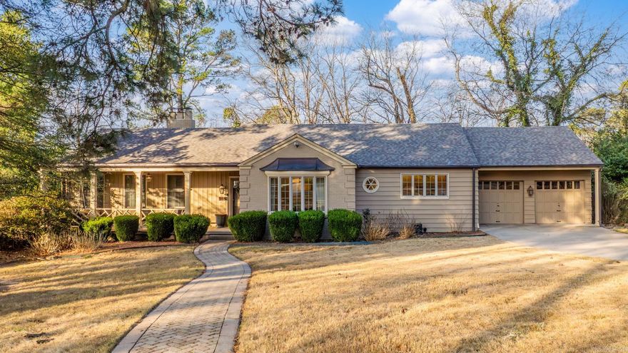 Tucked away on a quiet cul-de-sac in Normandy, this timeless brick home offers space, character, and privacy. Backing up to wooded green space and zoned for Forest Park Elementary, providing a peaceful setting minutes from everything Little Rock offers. And a new roof in 2026 adds peace of mind.  The home features 4 bedrooms and 2 baths across a flexible two-story layout. Hardwood floors anchor the main living areas, and the updated kitchen includes granite countertops, breakfast bar, pantry, and stainless appliances, opening to the dining and living rooms. The large living room has a gas fireplace, and French doors lead to a bright den or home office with built-ins and backyard views. Two bedrooms and an updated bath are on the main level; two more bedrooms and a full bath are downstairs. Outdoor spaces include a covered front porch, covered lower porch, and a large deck overlooking the landscaped backyard and water feature. A two car garage, walk up attic space, tankless water heater, high-efficiency HVAC and whole house generator complete the home. A rare opportunity to enjoy a serene setting and modern comfort in one of Little Rock’s most established neighborhoods See remarks