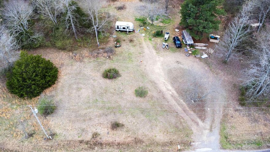 Great news! This property includes over 5 acres of timber, a cleared area for building, a seasonal creek, on-site utilities, mature hardwood trees, mostly level land, and frontage on a paved road. Don't miss out on this amazing opportunity!