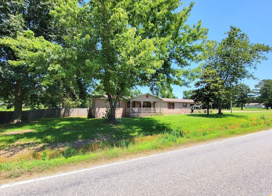 Come Take A Look and Make an Offer! Need lots of space? Check out this double wide with 3 bedrooms, 2 baths, beautiful new kitchen and office.  It has a large back porch with a covered patio and a 728 square foot covered carport.  This property has city water and sewer, 32 x 40 shop on 3 acres in Lockesburg. It also has a hookup for a mobile home in the back.