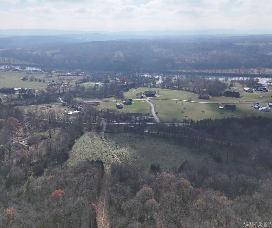 What an incredible property. Enter the property and head up the hill to a homesite like no other atop this beautiful mountain top. The views are spectacular including a view of the White river and valley below as well as a stunning mountain view. You can even see the Cotter water tower from the top. The topography has multiple areas that are buildable. Two ponds on the property. An existing water well, RV hook up with septic. Condition of the well and pump are unknown. There is a 1680 sqft metal building on the property with three bays. One is large enough for an RV. If you are looking for a property to build a home close to some of the most amazing fishing Arkansas has to offer, you will not be disappointed with these 61 acers. You could build multiple homes or cabins on this property with great views. Give us a call to take a look. Rebekah 479-530-5592 Gabby 479-325-9260