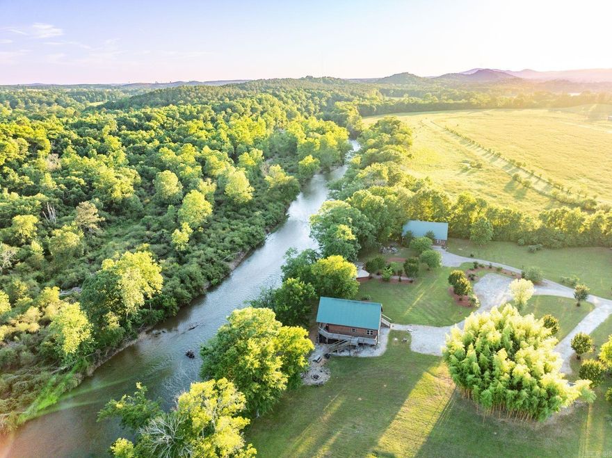 This rare, income-producing riverfront property includes five fully furnished cabins situated along the Caddo River. Currently operated as a successful short-term rental business, the property offers immediate income potential and room for future development. Grounds feature mature trees, fruit trees, blueberry bushes, fire pits, grills, and a scenic deck with picnic tables overlooking the river.   Cabin Details: River Ridge– 2,400± SF | 3 BR, 2 BA | Sleeps 8 Sits directly on the river with stunning views and generous living space Dreamcatcher– 1,700± SF | 3 BR 2 BA | Sleeps 8 Also perched along the riverbank, this cozy retreat offers great views and a charming layout Sundancer– 850± SF | 2 BR, 1 BA | Sleeps 6 Centrally located on the property—perfect for smaller groups or couples Morning Star – 600± SF | 2 BR, 1 BA | Sleeps 6 Compact and welcoming, this cabin is a favorite among return guests Star Gazer– 2,500± SF | 3 BR, 2 BA | Sleeps 8 The newest and largest cabin, Features an incredible covered patio with an outdoor fireplace   Whether you're seeking a turn-key rental portfolio, a family retreat, or a hybrid investment, this unique riverfront property checks all the boxes.