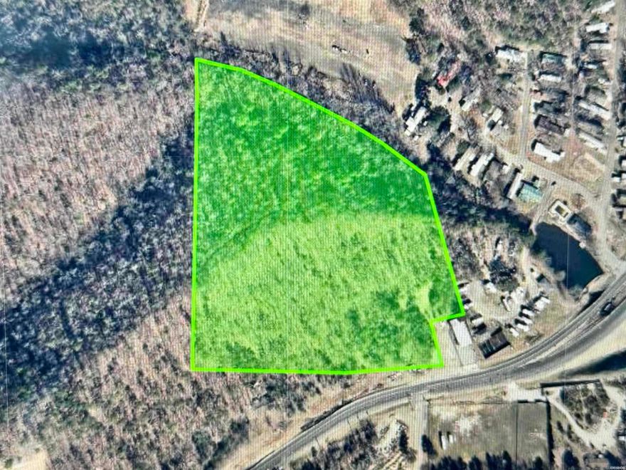 Approximately 12.5 acres of wooded land on Central Avenue (Hwy. 7 South) in Lakeside School District. The property lies outside the city limits and has over 200' road frontage with great visibility along the highway. The acreage nearest to the highway is relatively level and well suited for commercial development. There are several building spots on the ridgetop that would be ideal for a homesite or building rental cabins. The views at the highest point are pretty incredible. Lots of opportunities with this one!