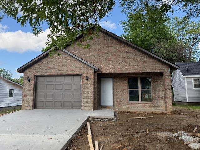 Are you looking to be part of the downtown Paragould revitalization and growth? Here is a great opportunity in this brand new all electric, brick construction, two inviting porches on front and back, walking distance to restaurants, shopping, and activities! All white cabinetry and an island kitchen with breakfast bar, granite countertops, stainless appliances, laminate flooring and carpet in bedrooms. The light walls and windows provide natural lighting and a fresh feel. This cottage style home is cozy and comfortable and most of all affordable! Three large bedrooms, two full baths, a pantry, and laundry room all in a compact design with storage and accessibility.