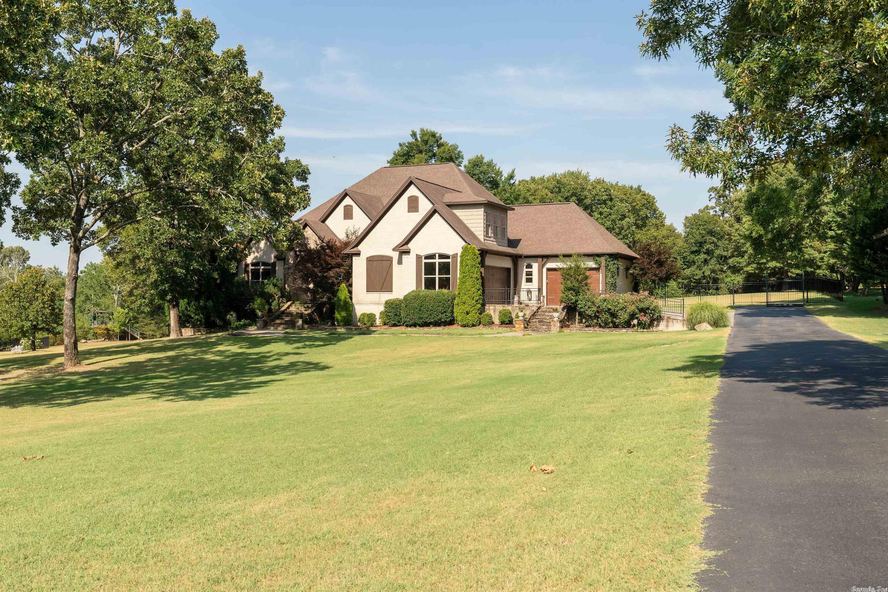 STUNNING 4BR/5BA home is located just outside the city limits in Club Creek Estates. The home offers an open floor plan concept w/ all bedrooms on main level. Beautifully painted cabinets w/ granite countertops, wood beam ceilings, copper sink, Dacor gas cooktop, pantry & wall oven are just a few of the many amenities you'll find in the kitchen. Upstairs are 2 full baths, media room, work out area, craft room & recently finished game room. Outdoor space w/ inground pool are perfect for entertaining!