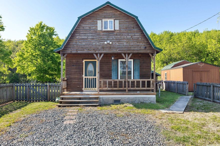 Here is a cute Log Cabin home sitting on .75 acres. This would be a great starter home or a cozy sanctuary you might want to get away to from time to time! This home features a spacious loft with lots of space for a bed and sitting area. Refrigerator, washer and dryer, and outbuildings to convey. *SEE AGENT REMARKS*