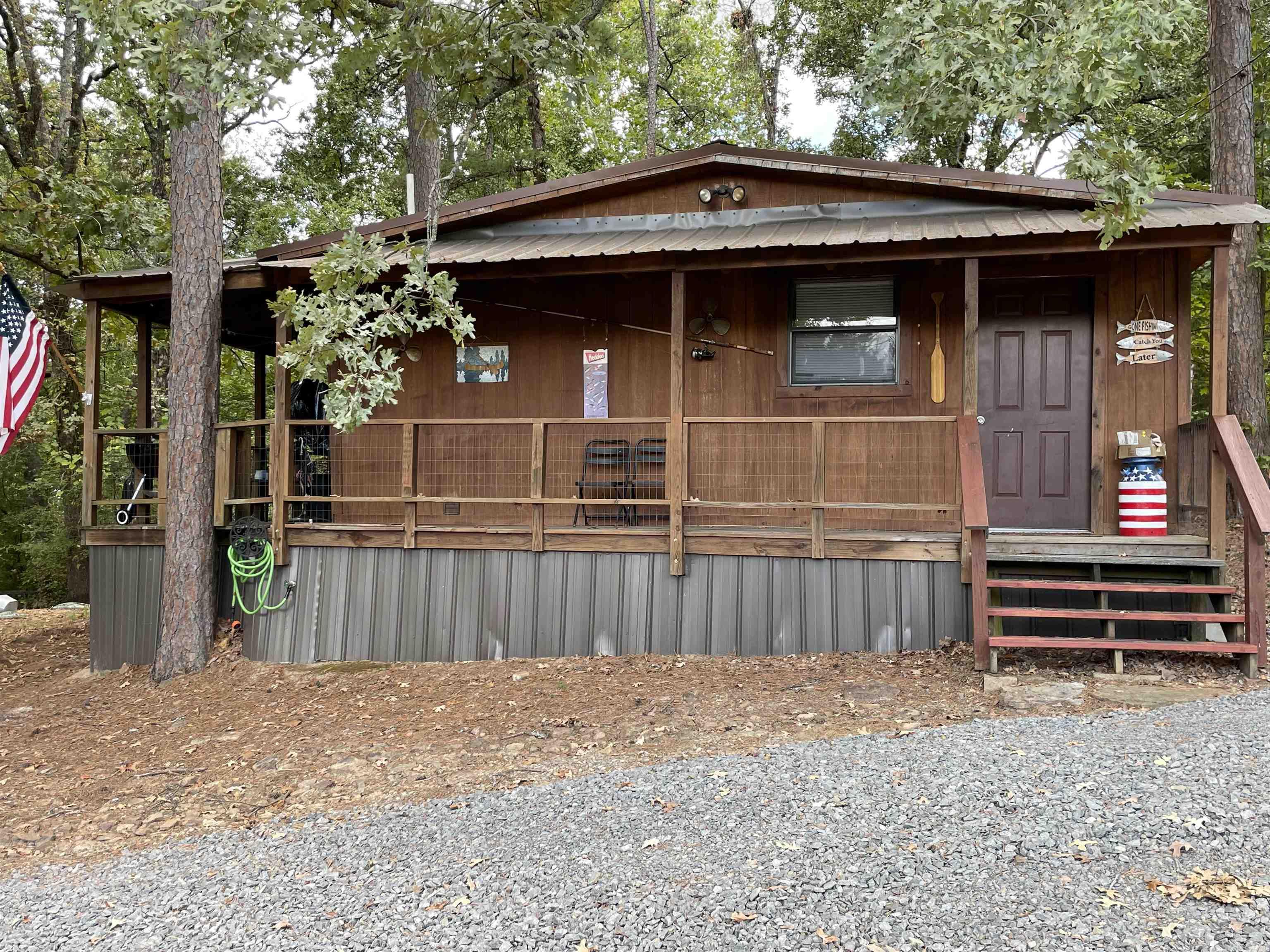 Cute Cabin!!  2 bedrooms, 1 full bath and 1/2 bath in laundry room.  Minutes to Devils Fork Park to launch your boat.  Minutes to golf, walking trails, ATV trails and bike trails.  All furniture to convey so bring your toothbrush!!  Lake access just down the road.