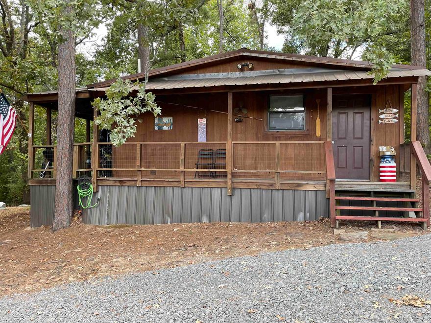 Cute Cabin!!  2 bedrooms, 1 full bath and 1/2 bath in laundry room.  Minutes to Devils Fork Park to launch your boat.  Minutes to golf, walking trails, ATV trails and bike trails.  All furniture to convey so bring your toothbrush!!  Lake access just down the road.