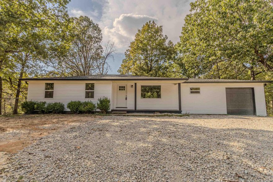 RENOVATED AND READY!! This 3 bedroom and 2 bath home has been updated from the studs with new electrical, plumbing, etc completed with an open floor plan, new and adorable kitchen, a large deck and a 30 x 30 shop!!! Located on 4 beautiful acres in Lafe!