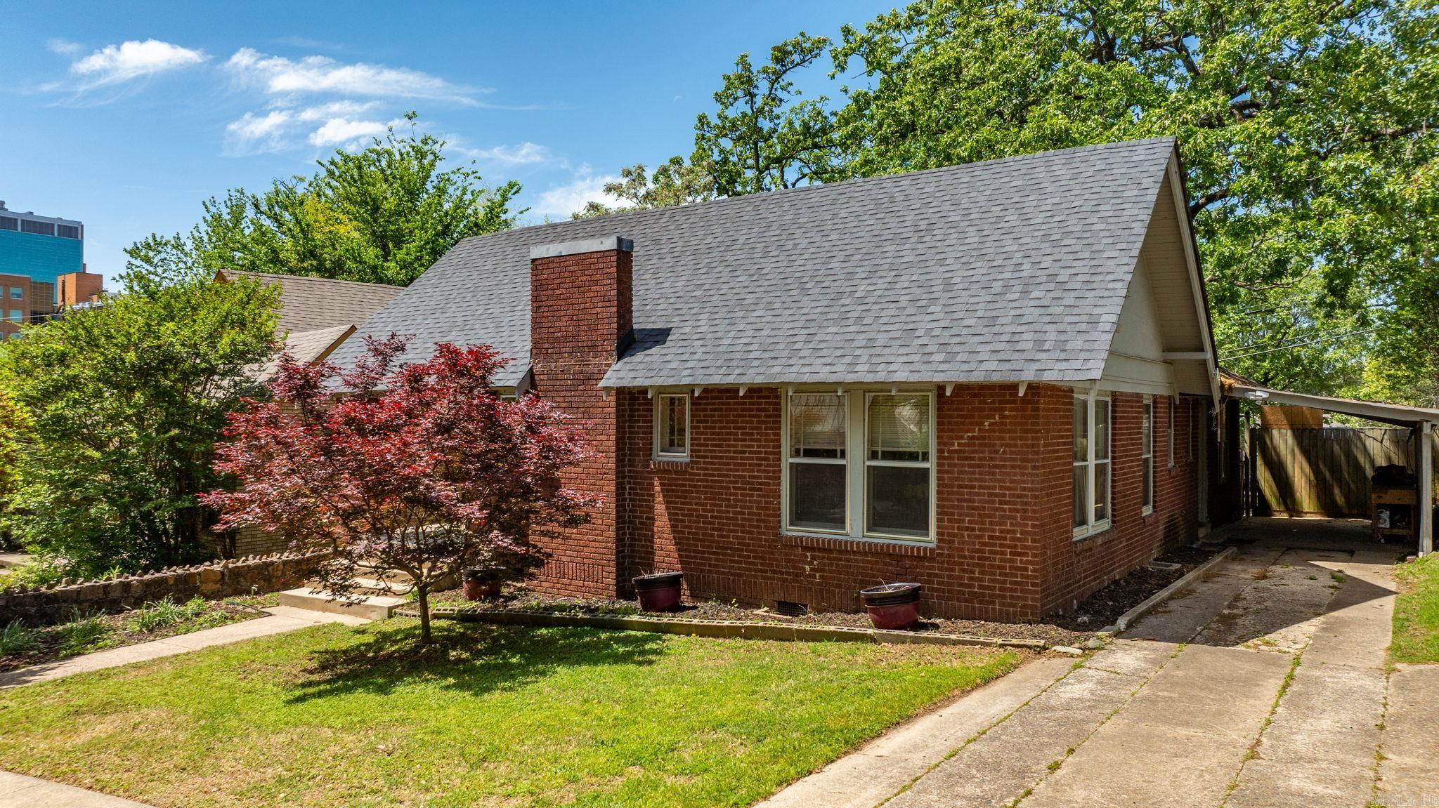 Charming Hillcrest Bungalow! This updated 1930s bungalow blends vintage charm with modern comfort. Enjoy a spacious covered front porch, large fenced backyard, and private patio—perfect for entertaining or relaxing. Inside features include a cozy gas fireplace, fresh paint, new LVP kitchen flooring, and a stylishly updated bathroom with porcelain tile and modern vanity. Major upgrades: new roof (June 2024), furnace (Jan. 2025), and concrete front steps. Move-in ready and full of character! All this home is waiting for is your special touch. (Fridge, washer, dryer, and storage shed convey)