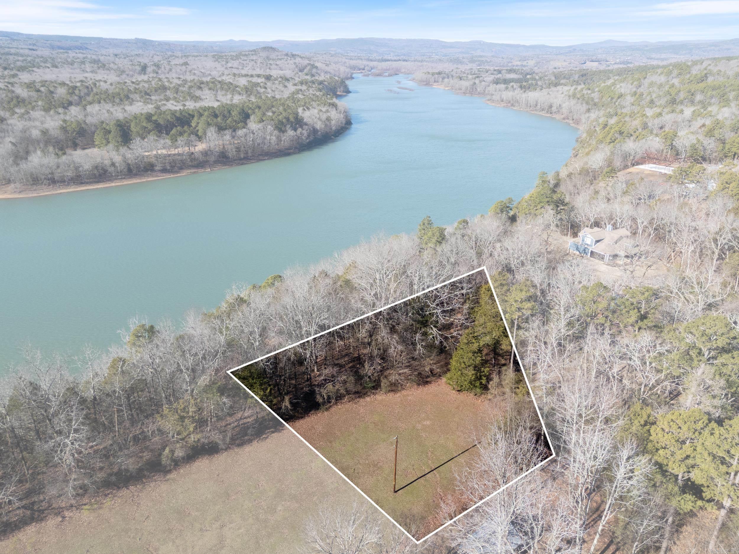 Discover your dream retreat with this stunning lake view lot in the serene Whispering Pines subdivision, overlooking the breathtaking Greers Ferry Lake. This .72-acre lot offers the perfect setting to build your custom cabin, surrounded by nature and featuring picturesque lakefront views. Additional lots are available for those seeking more space to expand your property. Utilities are conveniently located, making the building process smoother. Whispering Pines ensures a tranquil and well-maintained community, with no mobile homes allowed. Don’t miss this rare opportunity to own a piece of paradise and create the Lakeview getaway you’ve always envisioned. Contact us today to make it yours!