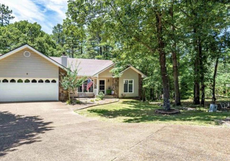 A Great Value Home in a Prime Location within the security gates of Hot Springs Village! Nestled on a quiet cul-de-sac near the West Gate, making it close to places such as the post office, pharmacy, restaurants, groceries, medical, etc. This charming 3-bedroom, 2-bath home offers comfort, convenience, and excellent value. Step inside to find beautiful LVP flooring throughout the main living area and the spacious primary bedroom, adding both style and durability. Cozy up in the inviting living room featuring a wood-burning fireplace, perfect for relaxing evenings at home. The updated kitchen is ideal for preparing meals and entertaining, complete with modern touches that make everyday living a breeze. Enjoy outdoor living in the fenced backyard for your pet, and a patio deck great for barbecues, gatherings, or simply enjoying your morning coffee. Privacy trees all across the backward. Also, you find a very large shop area - man cave - storage room. A laundry room and 2-car garage add to the functionality and storage options of this lovely home Whether youāre a first-time buyer or looking to downsize, this home is a rare find in a sought-after community. AGENTS SEE REMARKS