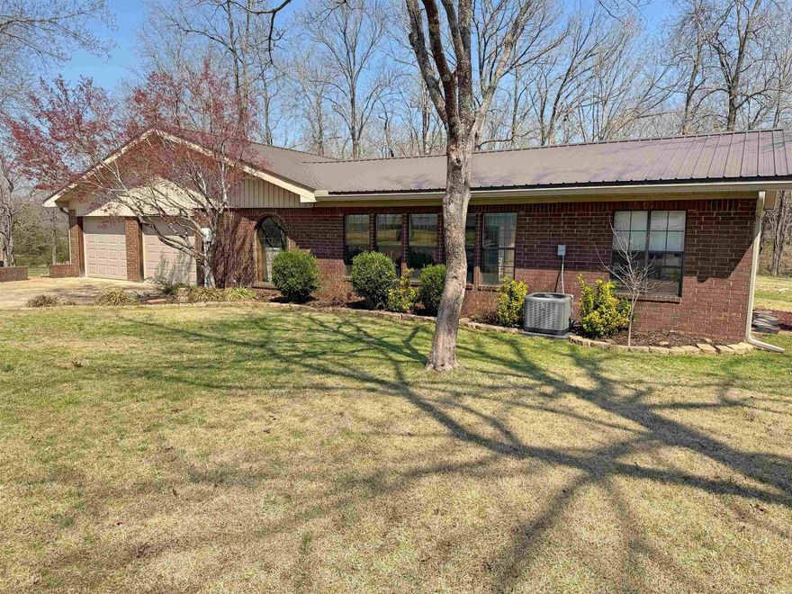 Mini farm setup on 5 fenced acres with everything already in place. This 3 bedroom, 2.5 bath home offers 3,190 sq ft with plenty of space to spread out, including two living areas and a sunroom that overlooks the property.  The home features Anderson windows, a new metal roof, and new vinyl siding. Appliances and washer/dryer convey, along with a built-in TV cabinet.  Outside is where this property really shines. You’ll find a stocked pond, a barn with multiple chicken coops, a separate hay barn, garden shed, and a 2-car detached garage. There’s also a parking pad with RV cover already in place.  No restrictions, so you’ve got the freedom to use it how you want—whether that’s animals, hobby farming, or just enjoying the space and privacy.  If you’ve been looking for a place that’s move-in ready with the hard work already done, this is it.